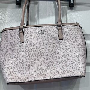Guess Los Angeles Hand Bag multiple pockets beautiful colors great condition.